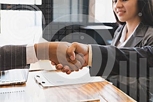 Business people shaking hands after finishing up a meeting. Two