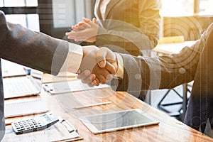 Business people shaking hands after finishing up a meeting. Two