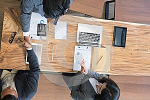 Business people shaking hands after finishing up a meeting. Two