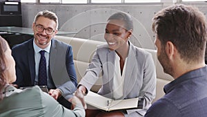 Business people shaking hands during meeting