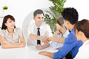 Business people shaking hands at a meeting