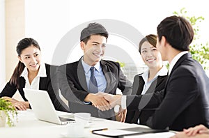 Business people shaking hands during meeting