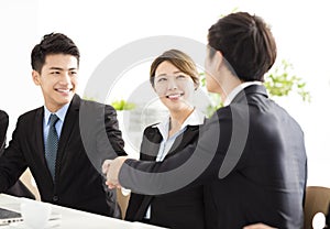 Business people shaking hands during meeting