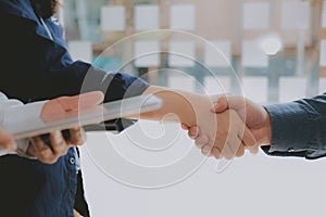 Business people shaking hands after meeting. colleagues handshaking. teamwork partnership concept