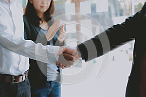 Business people shaking hands after meeting. colleagues handshaking. teamwork partnership concept