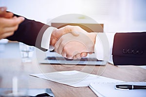 Business people shaking hands at meeting or negotiation in the office. Handshake concept. Partners are satisfied because