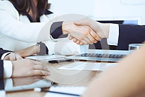 Business people shaking hands at meeting or negotiation in the office. Handshake concept. Partners are satisfied because