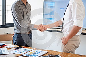 Business people shaking hands in meeting room, Successful deal after meeting