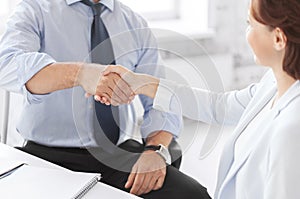 Business people shaking hands in office