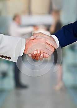 Business people, shaking hands and teamwork deal or agreement for b2b merger, investment or partnership. Collaboration