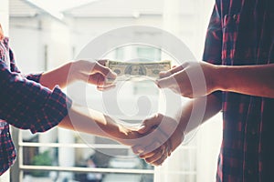 Business people shaking hands whil Business people shaking hands while standing at the working place, Finish success business good