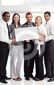 Business people showing a big white card