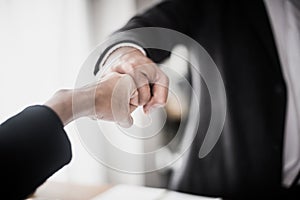 Business people showing Fist Bump after meeting partnership.