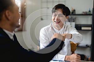 Business people showing Fist Bump after meeting partnership. Teamwork Concept.