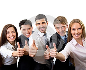 Business people showing thumbs up sign