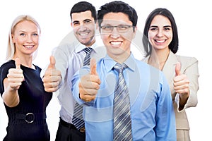 Business people showing thumbs up sign