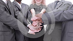 Business people showing unity with their hands together