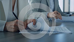 Business people sign contract in office. Closeup hand holding pen put signature