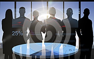 Business people silhouettes with pie chart