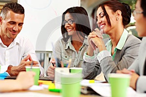 Business people sitting around the table at the meeting