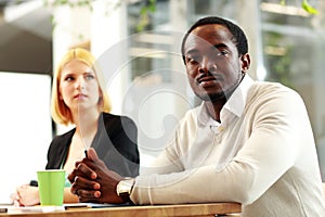 Business people sitting around a table during a meeting