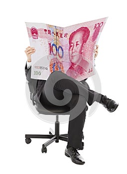 Business people sitting on a chair with china currency