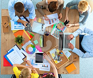 Business people sitting and discussing at business meeting, in office