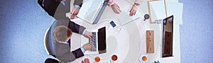 Business people sitting and discussing at business meeting, in office