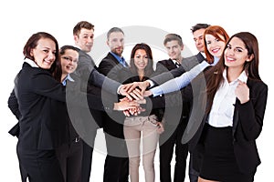 Business people stacking hands