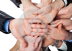 Business people stacking hands