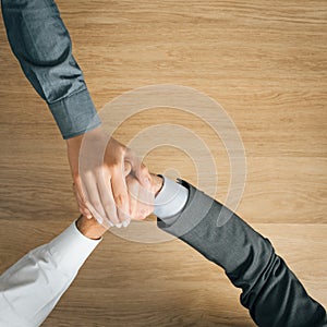 Business people stacking hands