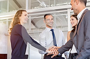 Business people stacking hands