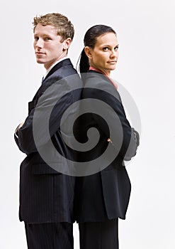 Business people standing back to back