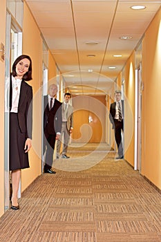 Business people standing in corridor