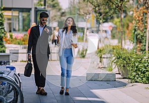 Business people standing at outdoor while talking