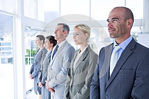 Business people standing in a row