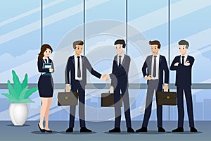 Business people standing and shake hands each other for cooperation and make a deal with their teamwork.