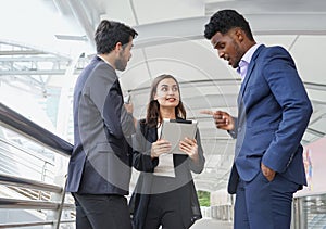 business people in suit standing and meeting outside office