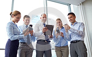 Business people with tablet pc and smartphones