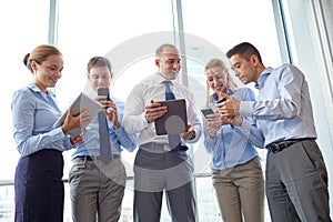 Business people with tablet pc and smartphones