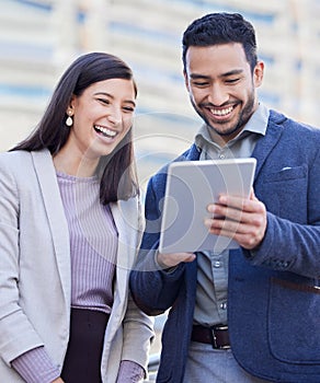 Business people, tablet and team laughing outdoor in a city with internet connection for social media. Happy man and