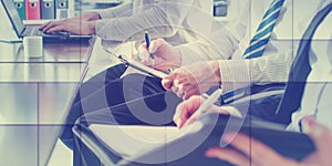 Business people taking notes, geometric pattern