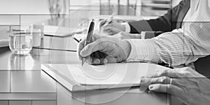 Business people taking notes, geometric pattern