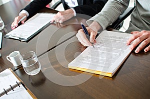 Business people taking notes