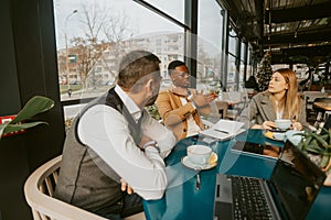 Business people talking at the cafe