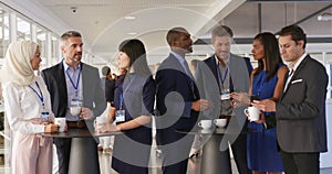 Business people talking during a coffee break at a convention