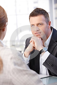 Business people talking at desk