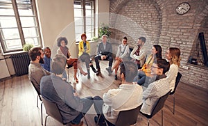 Business people talking at group meeting