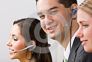 Business people talking on headsets