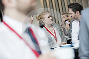 Business people talking at lobby in convention center